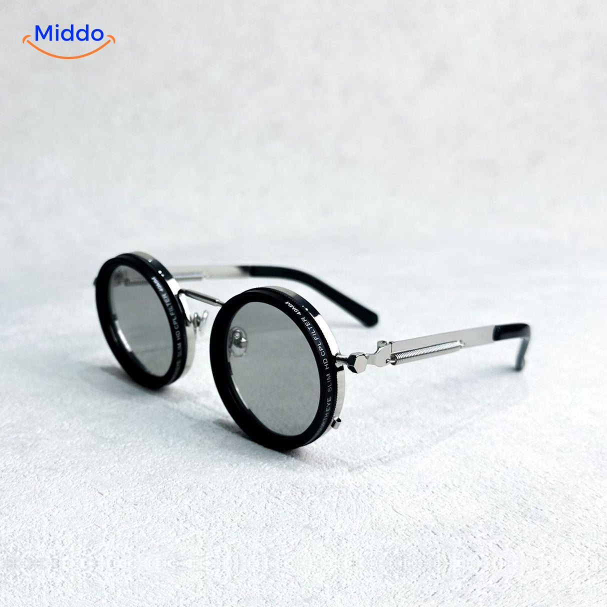 Round metal frame sunglasses with premium UV-protected lens technology.