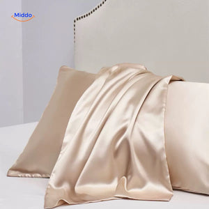 Champagne satin pillowcase flat lay soft luxe color.