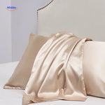 Champagne satin pillowcase flat lay soft luxe color.