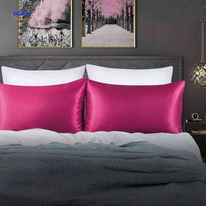 Fuchsia satin pillowcase displayed flat vibrant color option.