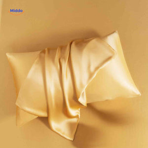 Gold satin pillowcase flat lay showcasing elegant color option.