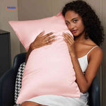 Light pink satin pillowcase on pillow for overnight comfort.