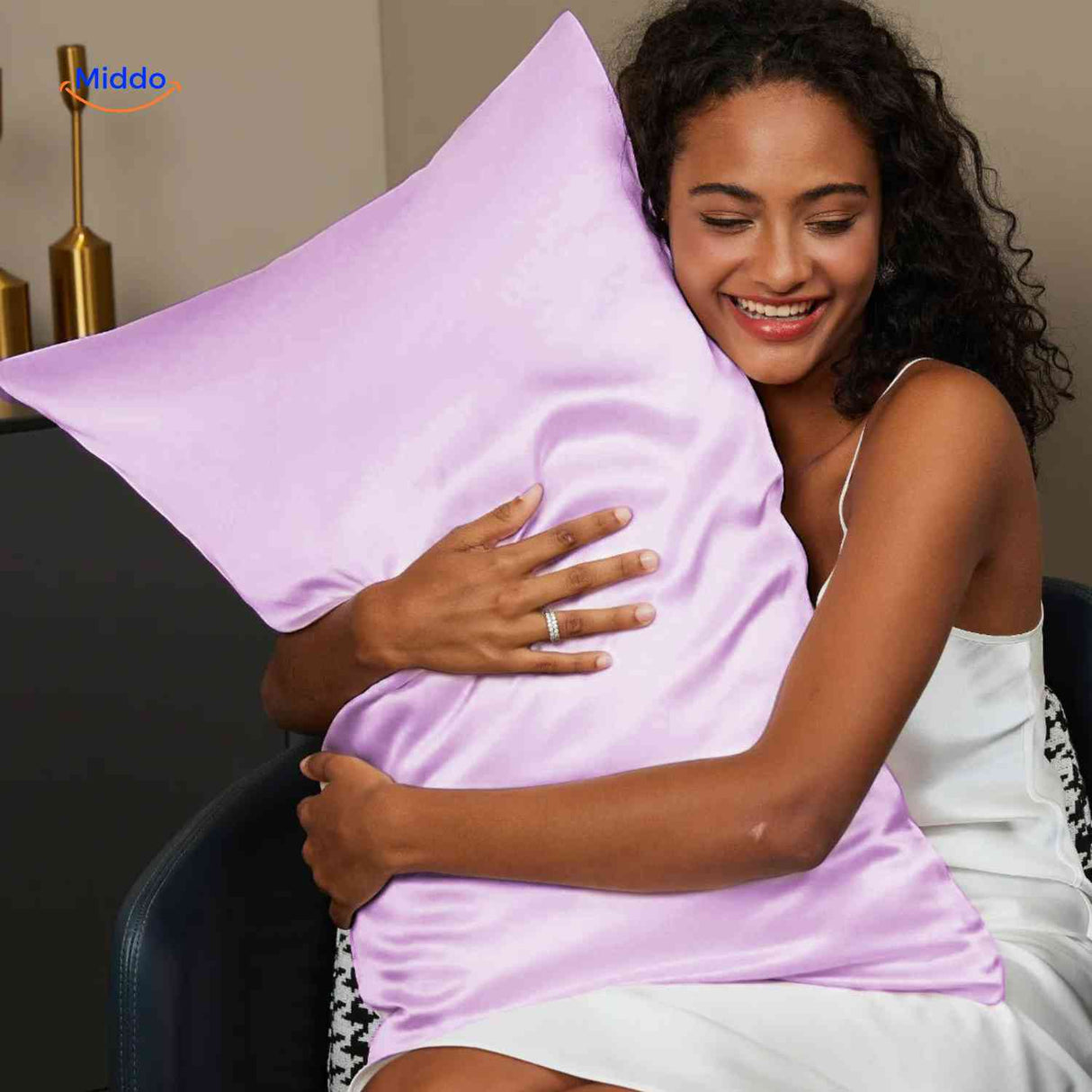 Lilac satin pillowcase styled for skin care benefits.