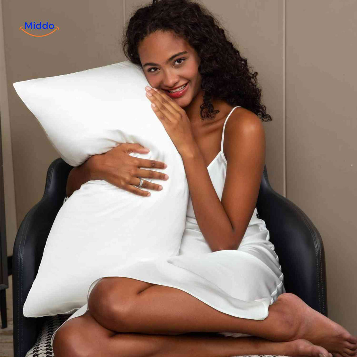 White satin pillowcase styled on pillow for hair and skin care.