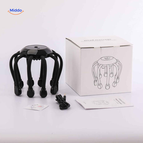 Electric scalp head massager next to USB charger showing charging port and cable connection