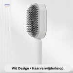 White self-cleaning hair brush with one-click hair removal button.