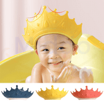 Child wearing yellow ShampooCrown shower shield while bathing safely.