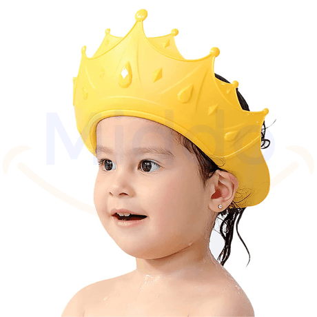 Toddler in a yellow ShampooCrown keeps water and soap out of eyes.