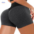Gray textured ion fiber shaping shorts with seamless construction for smooth body shaping.