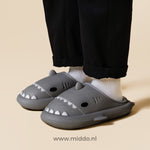 Black shark slippers with classic comfort for the family.