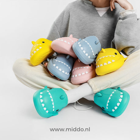 Shark slippers available in multiple vibrant colors.