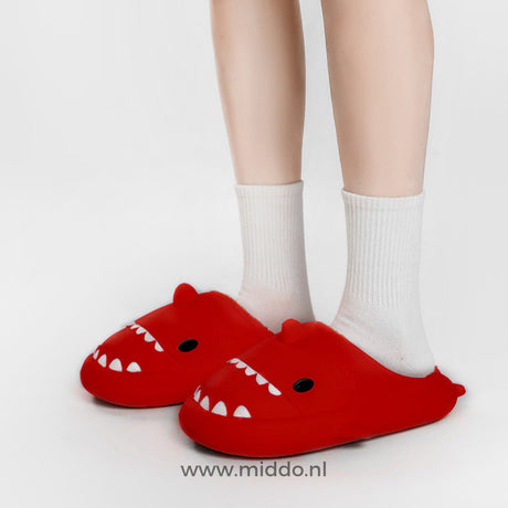 Red shark slippers bringing playful charm to sleepwear.