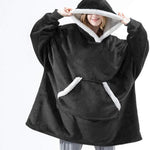 Oversized sherpa fleece hoodie in black with white trim and ultra-soft sherpa fabric.
