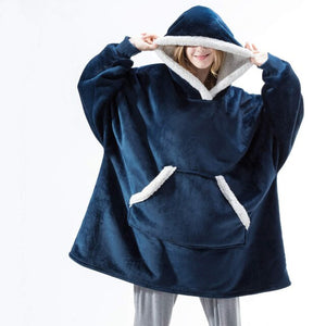 Oversized sherpa fleece hoodie in blue with white trim detail and soft fleece interior.