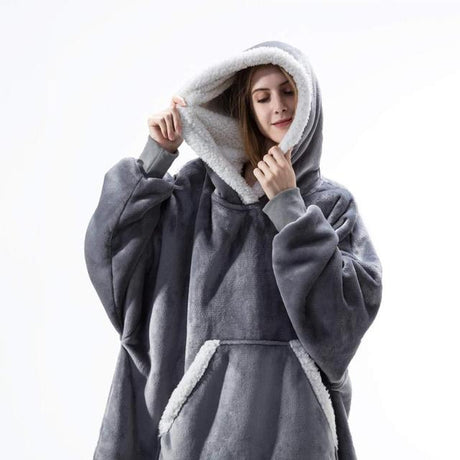 Oversized sherpa fleece hoodie in grey with white accent trim and plush lining.