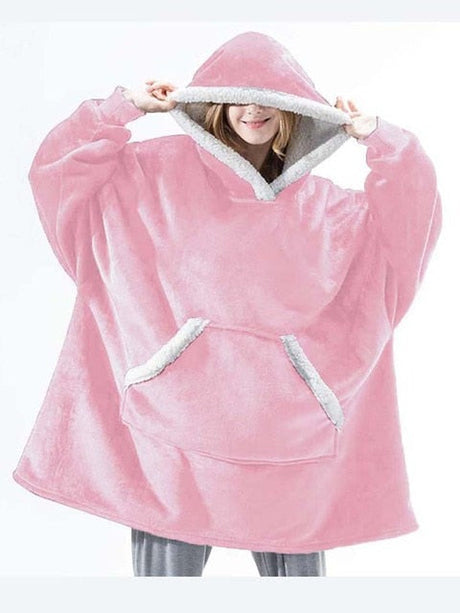 Oversized sherpa fleece hoodie in light pink with white trim and warmth-enhancing fabric.