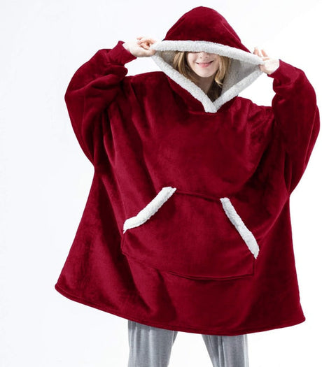 Oversized sherpa fleece hoodie in red with white trim and cozy fleece construction.