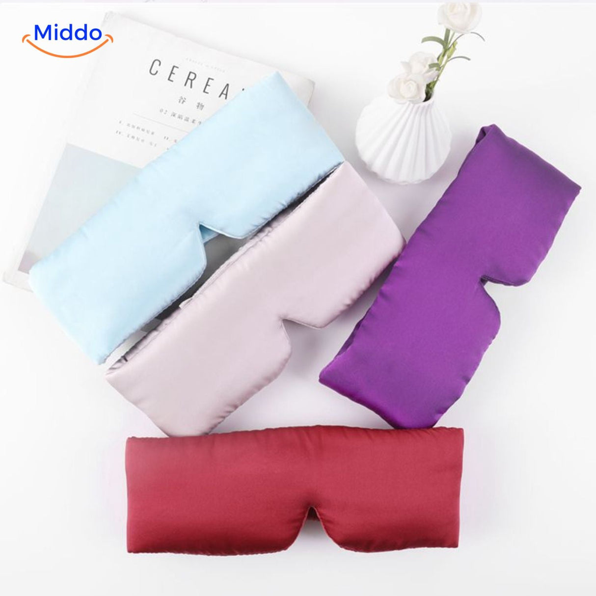 Mulberry silk sleep mask available in four reversible color options including black, blue, burgundy and gold.