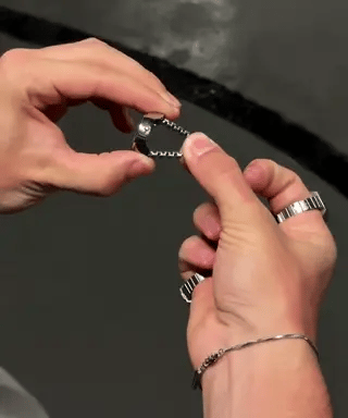 Silver ring watch with adjustable band for perfect custom fit.
