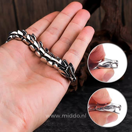 Silver dragon bracelet styled in a lifestyle setting, worn casually on the wrist.