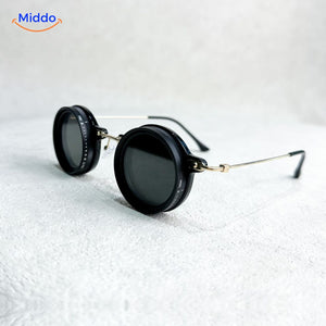 Round sunglasses with silver metal frame and UV light reduction lens.