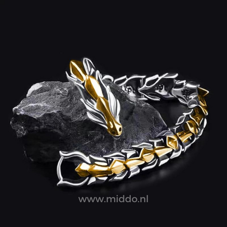 Silver and gold dragon bracelets together on a black stone surface showing both color options.