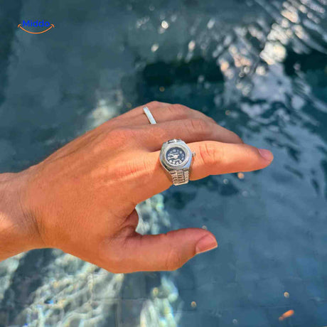 Silver mens ring watch with quartz movement and sophisticated style.