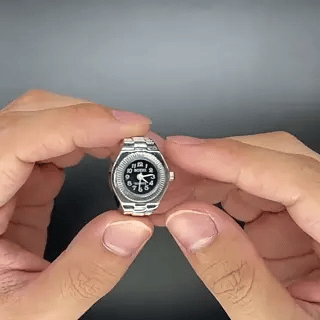Silver mini ring watch with compact sleek design and readable dial.