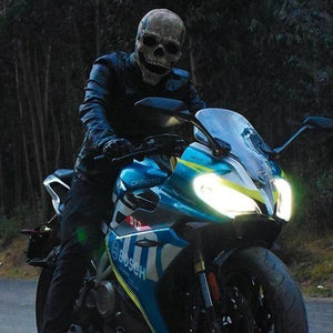 Skull mask with motorized moving jaw feature for interactive Halloween mask.