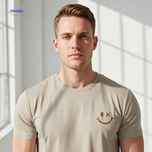 Close-up of smiley logo on beige cotton t-shirt showing print quality.