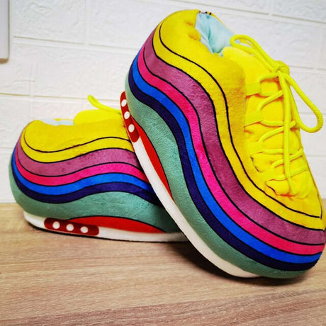 Rainbow sneaker slippers offering warm comfort with fashionable multi-color design.