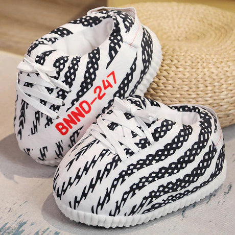 Striped black and white sneaker slippers combining style with comfort and grip.