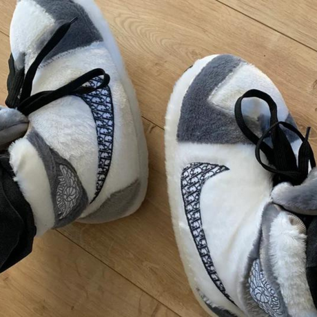 White and gray warm sneaker slippers providing cozy comfort with secure traction.