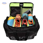 SNKRPro travel bag packed with sneakers, shoes, and clothing items.