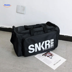 SNKRPro sports bag close-up with prominent white text branding detail.