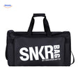 SNKRPro black sports travel bag held in hand with white text branding.