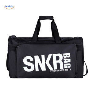 SNKRPro black sports travel bag held in hand with white text branding.