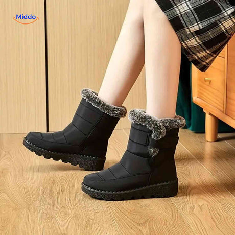 Black SnowLuxe women's snow boots with soft interior lining and cushioned support.