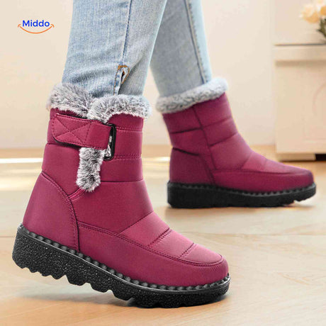 Red SnowLuxe winter boots with fur lining delivering warmth and cozy comfort.
