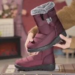 Red SnowLuxe waterproof snow boots with fur lining for reliable winter protection.