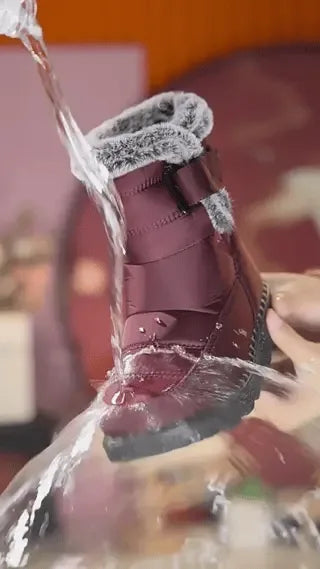 Red SnowLuxe winter boots designed for all-day comfort and reliable cold-weather warmth.