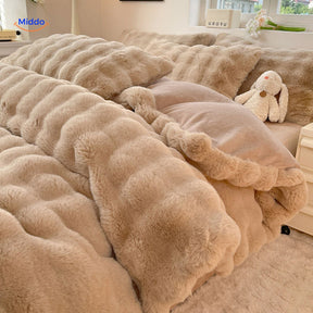 Beige plush rabbit fur duvet with matching pillows.