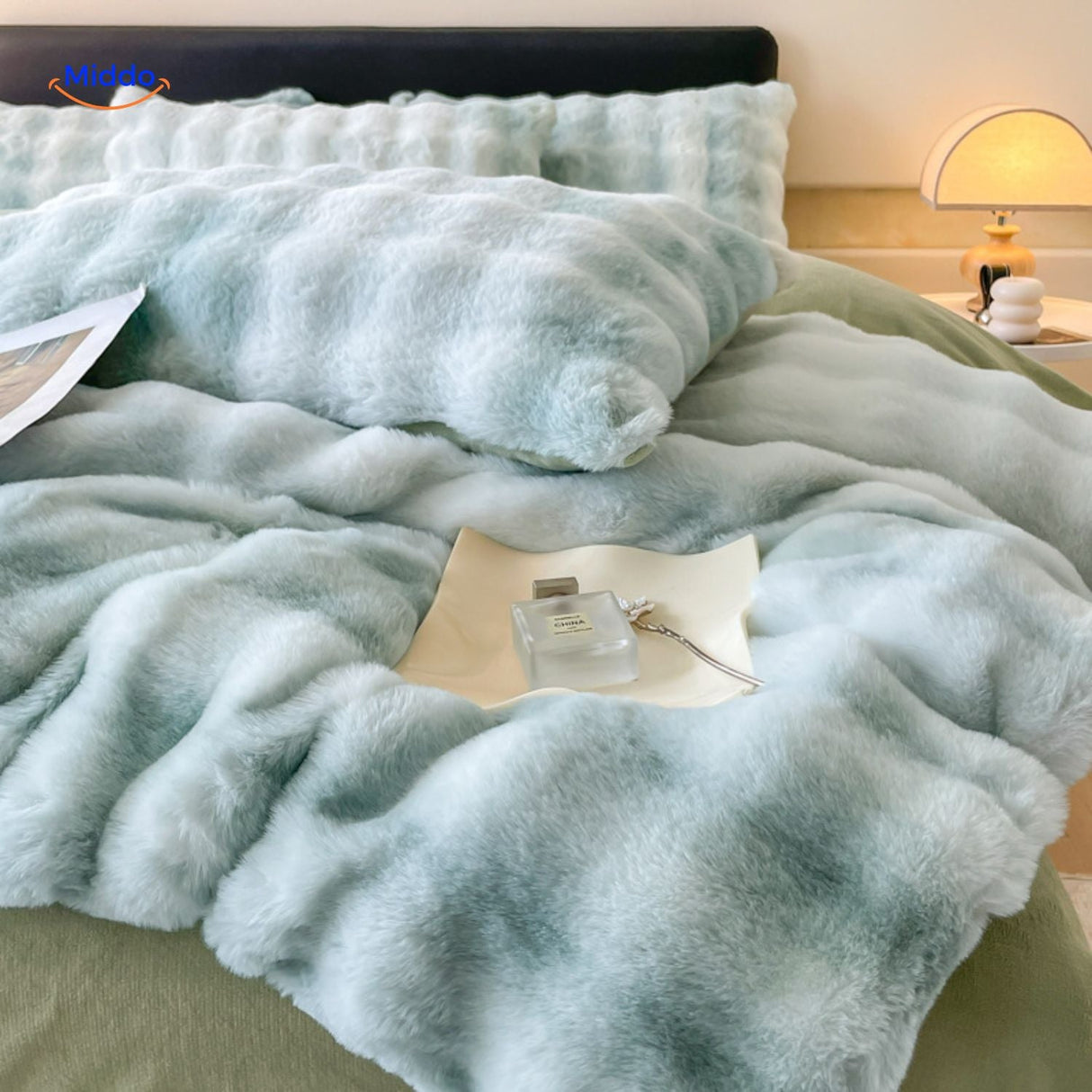 Green plush duvet and matching rabbit fur pillows.