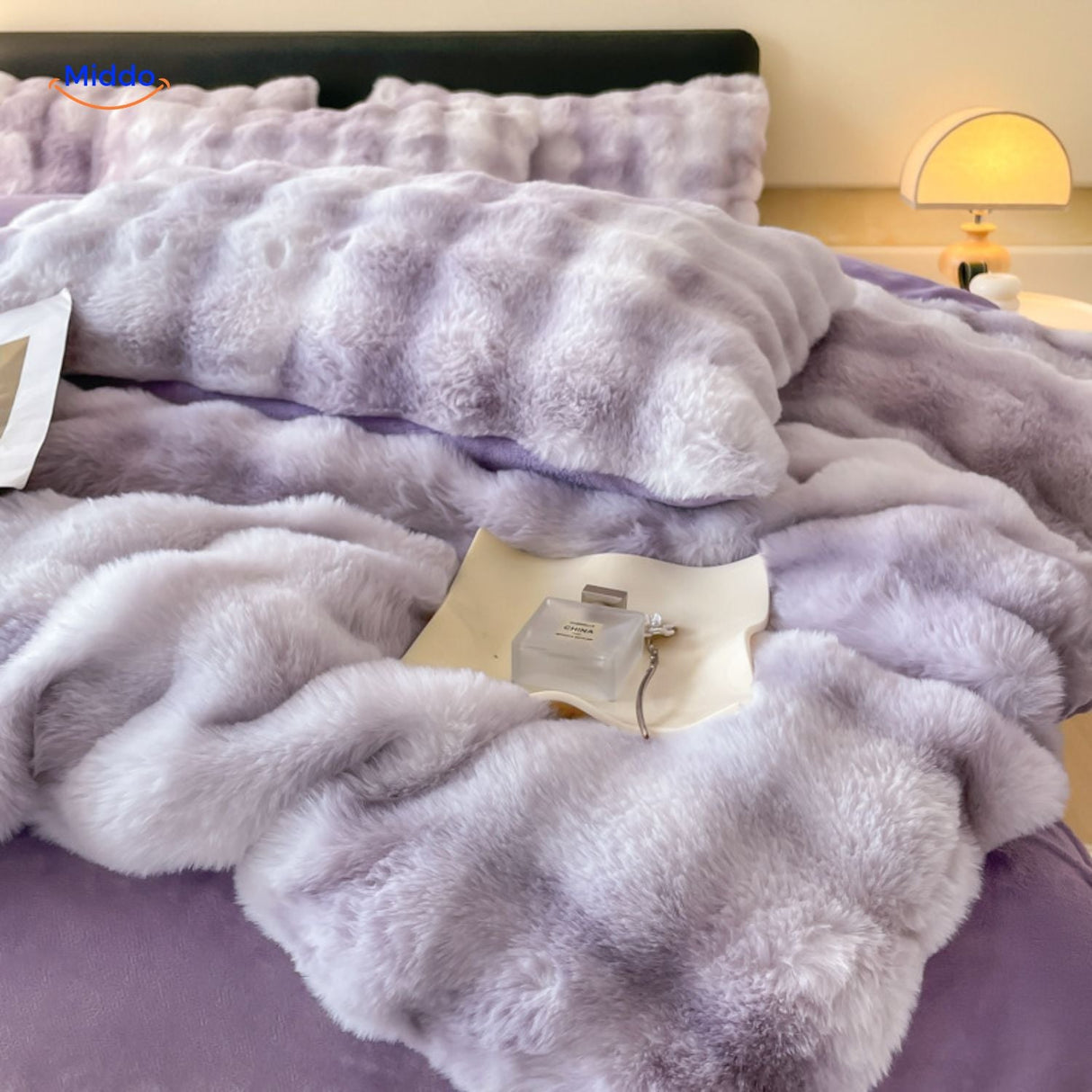 Lilac plush duvet cover set with coordinating pillows.