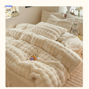Complete white plush duvet cover set on comfortable bed.