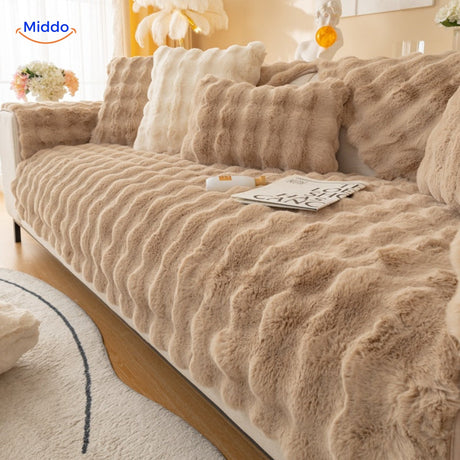 Beige plush sofa cover with coordinating cushions for warm, inviting furniture styling.