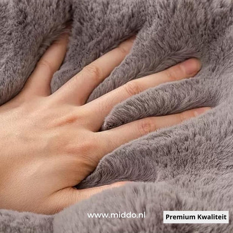 Gray plush sofa cover showing soft, durable fabric that resists compression and wrinkling.