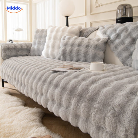 Gray plush furniture cover with matching cushions providing neutral pet protection.