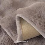 Non-slip backing detail on gray furniture cover prevents shifting and keeps cover secure.