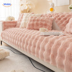 Pink and white plush furniture cover with cushions creates cheerful, cozy living space.
